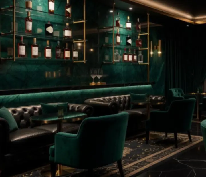 Atmospheric jade-black bar at The Flop & Fork with golden lighting and curated glassware
